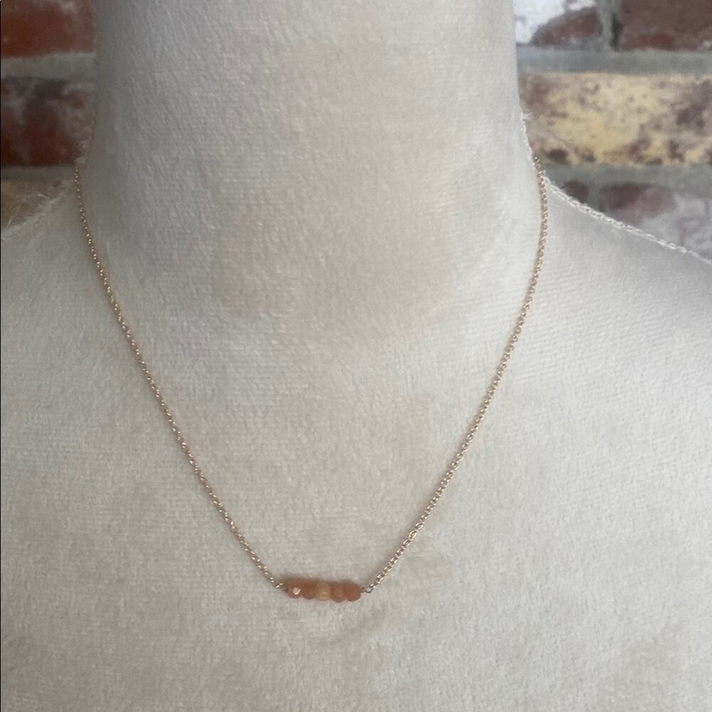 Elegant Gold and Peach Beaded Necklace